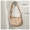 Detail of apricot corduroy crossbody bag with adjustable strap and cute puppy pendant - Khaki (With Dog Charm)