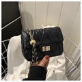 Detail of black quilted leather shoulder bag with gold chain and metal sphere ornament - Black