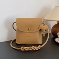 Camel pebble leather crossbody bag with elephant charm and braided shoulder strap - Brown