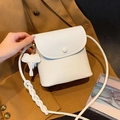White pebbled leather crossbody bag with elephant charm and woven shoulder strap - Off-white