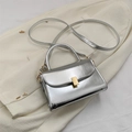 Chic silver metallic square bag with curved top handle and gold rectangular clasp lock - Silver