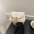 Minimalist beige leather saddle bag with gold metal buckle and twisted knotted strap - White