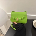 Bright green saddle bag for women with gold clasp and matching rope shoulder strap - Green