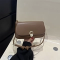 Minimalist brown leather underarm bag with gold C-buckle and decorative knotted strap - Brown