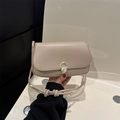 Chic beige leather crossbody bag with pearl buckle and stylish knotted shoulder strap - Khaki