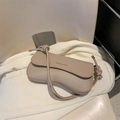 Elegant milk tea colored underarm bag with unique knotted strap and gold lettering - Khaki