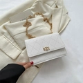 White quilted shoulder bag with gold chain strap and classic turn-lock closure - White