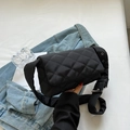 Black quilted nylon crossbody bag with wide silver eyelet strap and diamond stitching - Black