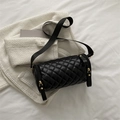 Chic black quilted cylinder crossbody bag with wide strap and gold hardware accents - Black