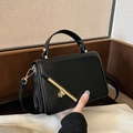 Classic black structured handbag with gold hardware and removable shoulder strap - Black