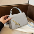 Solid blue-grey crossbody bag with lychee grain leather and gold metal buckle - Gray