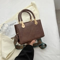 Brown rectangular handbag with woven handle and colorful wide printed shoulder strap - Coffee
