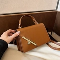 Brown textured leather crossbody bag with elegant gold metal twist lock and top handle - Yellow Brown