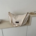 Minimalist cream crescent crossbody bag with wide shoulder strap and fashion label - White (Without Charm)
