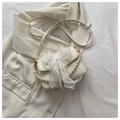 Chic cream crossbody bag featuring a sheer organza bow and elegant pearl chain strap - White