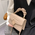 Beige crossbody bag with textured leather and unique scrunchie handle design - Khaki