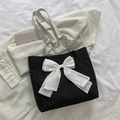 Large black crinkled tote bag with oversized white bow and silver chain strap - Black