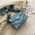 Light blue tweed crossbody bag featuring daisy print wide strap and chunky chain detail - Blue