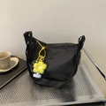Black nylon crescent crossbody bag with yellow sunflower plush charm on metal trolley - Black (With Yellow Flower Pendant)
