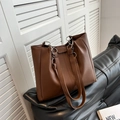Large dark brown faux leather tote bag with silver metal rings and minimalist design - Coffee