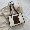 Borsa tote minimalista crema con profili marrone scuro e manici superiori eleganti - Marrone