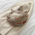 Floral embroidered sling bag with colorful floral patterns and wide decorative strap - Red