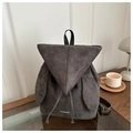Deep grey suede backpack with triangle flap and rabbit ear decor on wooden table - Gray