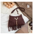 Detail of dark brown faux suede bucket bag with gold deer head and long chain tassels - Brown