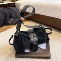 Fashionable black pleated satchel featuring a wide leather belt and silver buckle - Black
