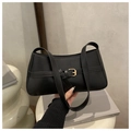 Minimalist black matte leather underarm bag with elegant gold buckle and shoulder strap - Black