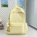 Minimalist light yellow student backpack with embroidered bow and moon pendant charm - With Rope Pendant / Yellow