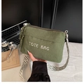 Detail of army green corduroy tote bag with TOTE BAG embroidery and woven strap - Green