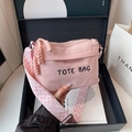 Pink corduroy tote bag for women featuring black embroidery and a wide geometric strap - Pink
