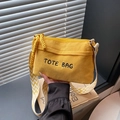 Yellow corduroy tote bag with embroidered logo and geometric patterned shoulder strap - Yellow