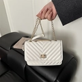 White quilted crossbody bag with V-pattern texture and elegant gold chain strap - White