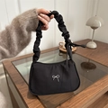 Black nylon shoulder bag with silver bow accent and ruched handle for women - Black