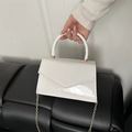 Glossy white patent leather handbag with thick handle and elegant gold chain strap - White