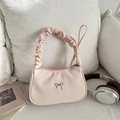 Pink hobo handbag with ruched handle and silver bow accent on soft fabric - Pink