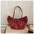 Close-up of pleated dark red cloud tote bag showing soft PU leather and gathered handle - Red