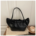 Detail of black pleated cloud bag with white Fashion Bags text on a wooden table - Black
