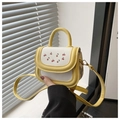 Detail of yellow and white crossbody bag with red cherry print and slender shoulder strap - Yellow