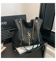Detail of glitter fabric tote bag featuring gold S-letter logo and chain strap - Black