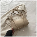 Detail of cream matte shoulder bag featuring textured faux leather and adjustable gold buckle - Khaki (No Pendant)