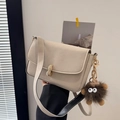 Beige square bag with golden peanut buckle and dark brown plush monster charm - With Pendant / Off White