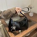 Glossy black patent leather underarm bag with silver bow and heart charm accent - Black