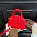 Vibrant red shell bag with elegant vine embroidery and gold hardware for winter fashion - Red