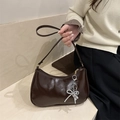 Dark brown PU leather shoulder bag with white beaded bow charm and silver metallic clip - Brown