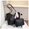Detail of black leather tote bag set with polka dot scarf in a stylish home setting - Tote And Pouch Set / Black
