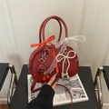 Mini red leopard style bowling bag with cherry charm, lace ribbons and pearl bow detail - Red