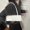 Chic white underarm shoulder bag for women with decorative bows and glossy leather finish - White